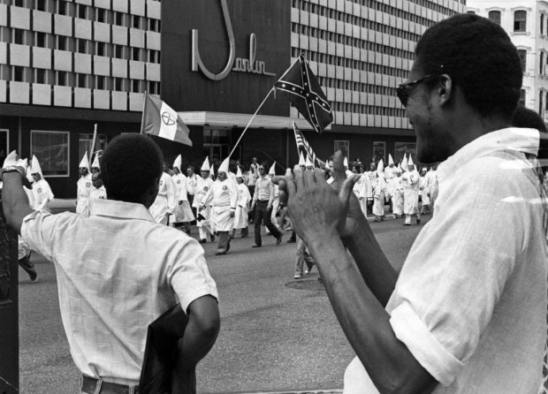 1976 - Black men mockingly applaud a KKK parade